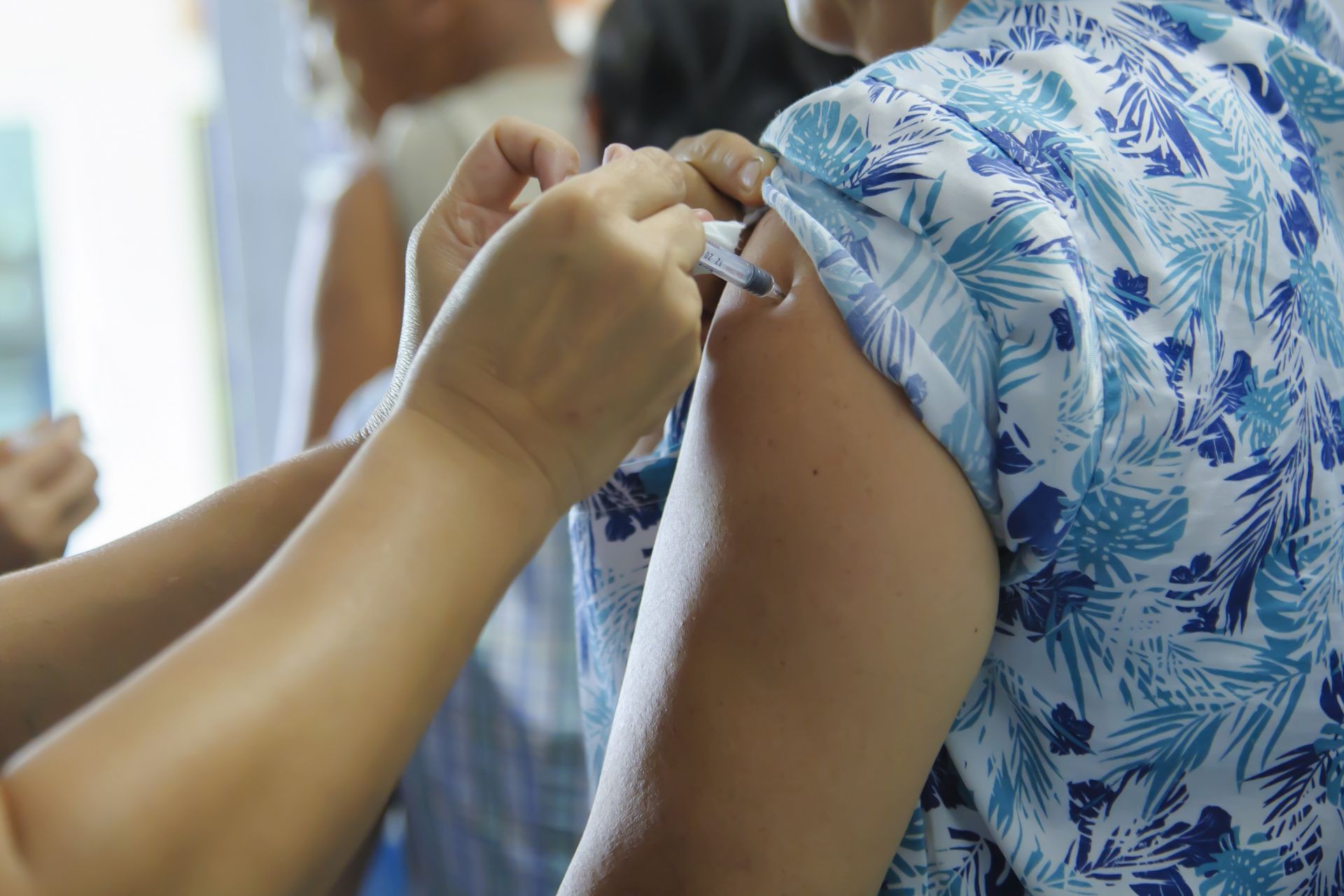 immunization vaccine injection , doctor inject vaccine to patient arm